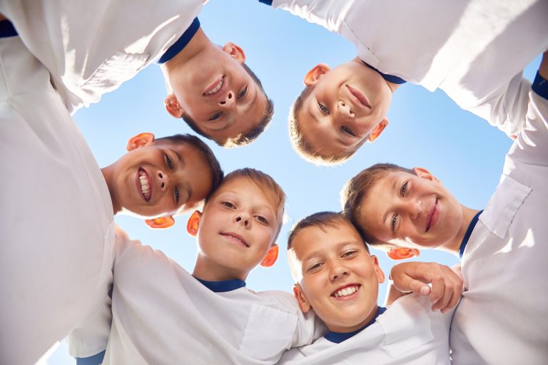 Happy Junior Football Team in Circle